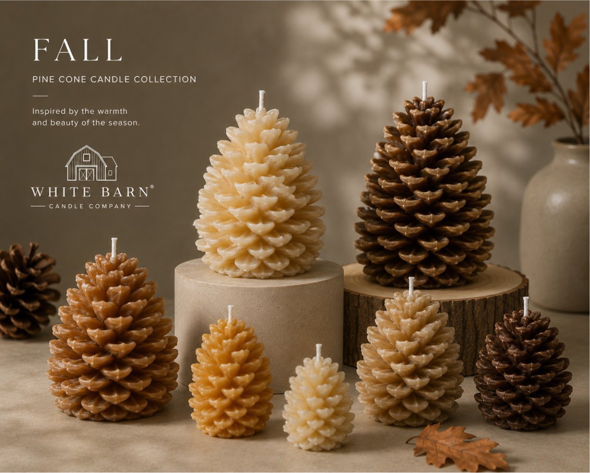A White Barn Candle Company fall collection page: pine cone shaped candles in cream, honey and dark tones grouped on wooden rounds with autumn leaves.